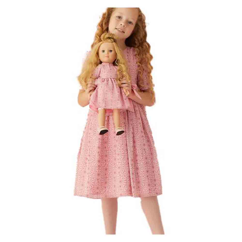 Doll in pink sales dress